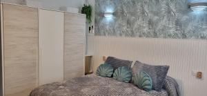a bedroom with a bed with two pillows on it at Casa del Pilar in Pinto