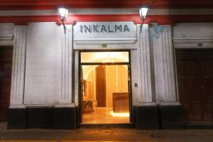 an entrance to a building with a sign that reads insulinemia at Hotel Inkalma Santa Marta in Arequipa