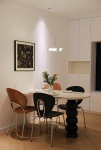 a dining room with a table and chairs at Merit黄浦 Bright and Modern 2Bed Condo unit in downtown Shanghai in Shanghai +14 photos