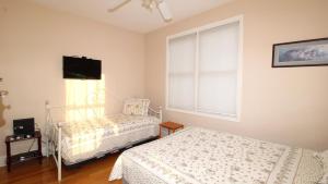 Llit o llits en una habitació de Mimis