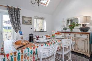 a kitchen with a table with food on it at Ivy Cottage in Tintagel