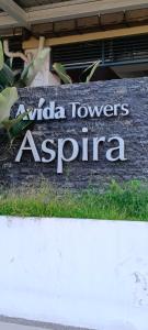 a sign for a koala towers asian centre at Josephine's place at Avida Aspira Tower 2 CDO in Cagayan de Oro