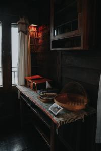 a table with a radio and a bowl on it at Baan Mon Muan in Mon Jam +102 photos