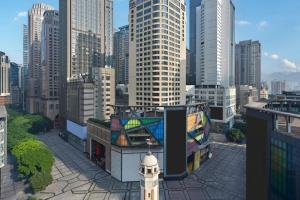a view of a city skyline with a clock tower at Four Points by Sheraton Chongqing in Chongqing