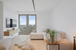 a living room with a couch and a tv at Zilt 15 in Ostend