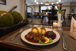 a plate of food sitting on a table at Villa Silva - Oberhof in Oberhof