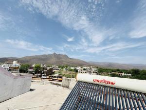 a view of a city from the roof of a building at Shivraj guest house in Ābu Road