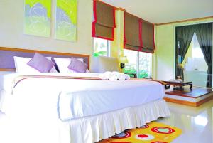 Postel nebo postele na pokoji v ubytování Moosiyard Hometel Khaoyai