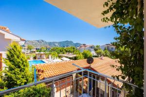 a view from the balcony of a house with a swimming pool at Safak Hotel Dalyan in Dalyan