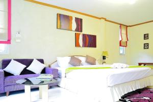 Postel nebo postele na pokoji v ubytování Moosiyard Hometel Khaoyai