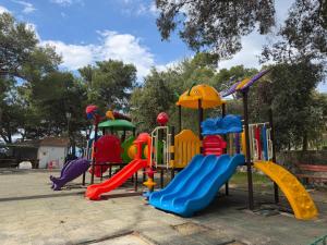 a playground with colorful slides and slidesktop at Glamour Pakoštane Mobile Home in Pakoštane