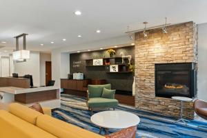 a lobby with a couch and a fireplace at Fairfield Inn & Suites by Marriott Durango in Durango