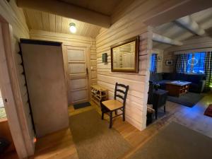 a room with a door and a chair and a table at Synnfjell hytta in Nord Torpa +38 photos