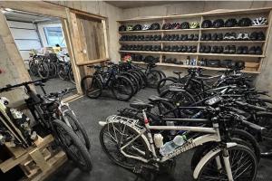 a bunch of bikes parked in a garage at Gästezimmer Lercher in Sankt Veit im Pongau +3 photos
