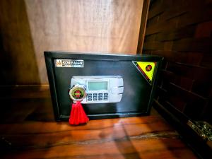 a black mailbox with a toy microwave in it at Win Hotel Vang Vieng in Vang Vieng