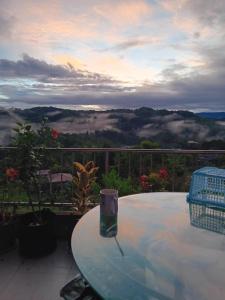 a table with a candle sitting on top of a balcony at Carpenters homestay in Sagada