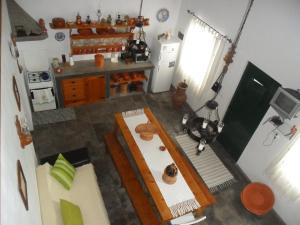 an overhead view of a kitchen with a table at Adega Ilhéu in Feteira