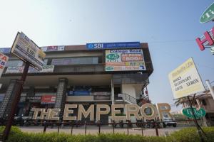 a building with the emergency sign in front of it at Hotel Tulsi in Nadiād
