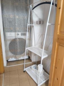a white shelf in a room next to a window at Родопско сърце in Chepelare +52 photos