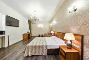 Postel nebo postele na pokoji v ubytování Allegro Ligovsky Prospekt + 37 fotografií