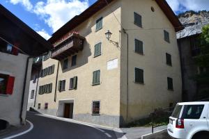 a white car parked in front of a building at Casa Sosio Martinelli in Valdidentro