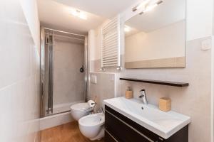 a bathroom with a sink and a toilet and a shower at -Fronte Mare- Centro Storico in Varazze +38 photos