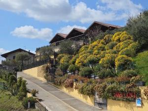 a house with plants on the side of a hill at Agricola Lanciani in Montefiore dellʼAso