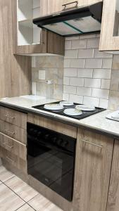 a kitchen with a stove top oven in a kitchen at One Thirty Six in Gqeberha +52 photos