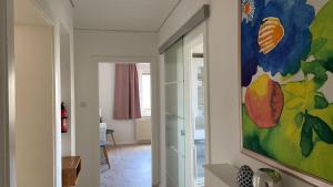 a painting hanging on a wall in a room at Zollhaus 26 in Hohegeiß