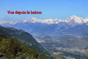 a view of a mountain valley with snow capped mountains at La Montagnette, VERCORIN in Vercorin