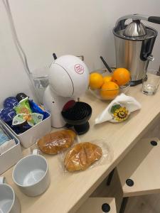 a counter with a mixer and some food on it at AmaRé House in Bari
