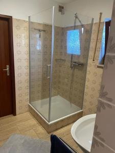 a bathroom with a shower and a sink at Bungalow Orketal Sauerland in Medebach