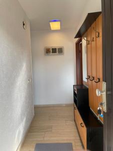 an empty room with a hallway with a heater on the wall at Bungalow Orketal Sauerland in Medebach