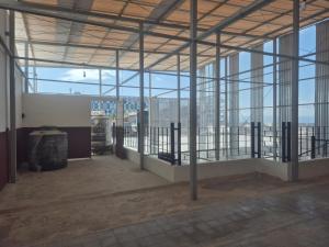 an empty room with a view of a building at ERCA Yogyakarta in Yogyakarta