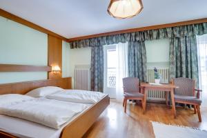 Кровать или кровати в номере Hotel Himmelreich