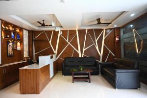a living room with a couch and a table at Hotel Lake View in Port Blair
