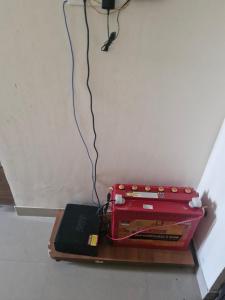 a machine sitting on a table with a laptop on it at Anwesha's Home Stay Alibaug in Alibaug