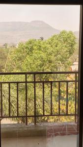 a view of a tree from a window at Anwesha's Home Stay Alibaug in Alibaug