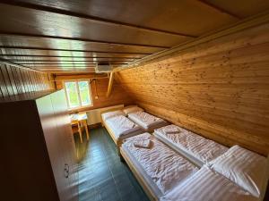an overhead view of two beds in a wooden room at Bouda Vlkoš in Horní Malá Úpa
