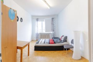 a bedroom with a bed in the middle of a room at Vacation, Work, Party in Allerstorf