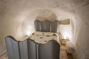 Postel nebo postele na pokoji v ubytování Casamata Matera