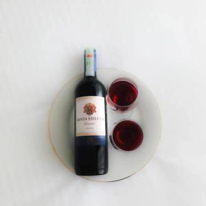 a bottle of wine and a glass of red wine at Negombo Sea waves in Negombo