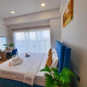 a bedroom with a large bed in a room at Negombo Sea waves in Negombo