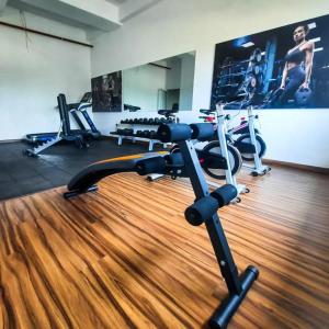 a gym with several exercise bikes in a room at Negombo Sea waves in Negombo