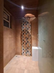 a room with a wall with a bunch of wine bottles at Kayo Resort Pench in Seonī