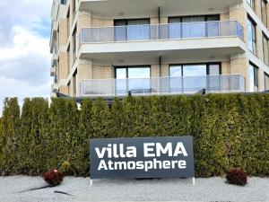 a sign in front of a building at AthmosphereVillaEma Apartments in Kranevo