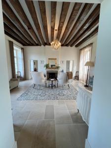 a large living room with a table and chairs at La Brosse Estate - Chateau de la Brosse in Lureuil