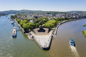 an aerial view of a river with boats in the water at 2 Koblenz - eigenes Bad,Küche - Wifi - Parkplatz in Koblenz +8 photos