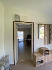 a living room with a door leading to a dining room at Bela Rada in Tivat