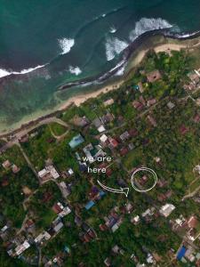 an aerial view of a house next to the ocean at Solmate Collective Guesthouse - Madiha in Matara